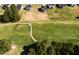 Scenic aerial view of lush green golf course near residential houses at 592 Barbour Farm Ln, Four Oaks, NC 27524