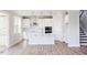 Bright kitchen features an island, stainless steel appliances, white subway tile and ample storage at 592 Barbour Farm Ln, Four Oaks, NC 27524