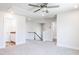 Spacious loft featuring plush carpeting, a ceiling fan, and two entryways at 592 Barbour Farm Ln, Four Oaks, NC 27524