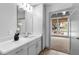 Modern bathroom vanity with neutral tones, complemented by a stylish door at 1300 St Marys St # 208, Raleigh, NC 27605