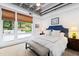 Bright bedroom with large windows and view of outdoor landscape at 1300 St Marys St # 208, Raleigh, NC 27605