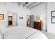 Spacious bedroom with carpet flooring and a view to the kitchen at 1300 St Marys St # 208, Raleigh, NC 27605