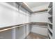 Walk-in closet with ample shelving and storage at 1300 St Marys St # 208, Raleigh, NC 27605