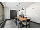 Modern dining room with a large wooden table and stylish pendant lighting at 1300 St Marys St # 208, Raleigh, NC 27605