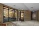 Modern brick building entrance featuring large windows and a sleek black framed glass door at 1300 St Marys St # 208, Raleigh, NC 27605