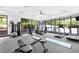 Bright gym featuring modern equipment, large windows, and lots of natural light at 1300 St Marys St # 208, Raleigh, NC 27605