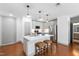 Modern kitchen featuring a large island with seating and pendant lighting at 1300 St Marys St # 208, Raleigh, NC 27605