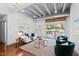 Bright living room with exposed ceiling, modern furnishings and sliding glass door leading to a balcony at 1300 St Marys St # 208, Raleigh, NC 27605