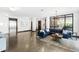 Inviting lobby area with a modern couch, stylish furnishings, and elevator access at 1300 St Marys St # 208, Raleigh, NC 27605