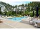 Community pool with lounge chairs and tables, perfect for relaxing and enjoying the outdoors at 1300 St Marys St # 208, Raleigh, NC 27605