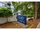 Community signage surrounded by greenery and landscaping at 1300 St Marys St # 208, Raleigh, NC 27605
