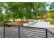 View from the balcony showcasing greenery and access to neighborhood at 1300 St Marys St # 208, Raleigh, NC 27605