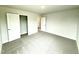 Bedroom featuring carpet, closet with doors open and a doorway to the next room at 122 Southern Estates Dr, Sanford, NC 27330