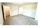 Bright bedroom with plush carpet, and easy access to the closet and hallway at 122 Southern Estates Dr, Sanford, NC 27330