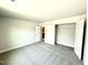 Bedroom with natural light, plush carpet, walk-in closet and easy access to the hallway at 122 Southern Estates Dr, Sanford, NC 27330