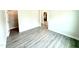 Bedroom view including an empty walk-in closet, gray floors and a view of the kitchen at 122 Southern Estates Dr, Sanford, NC 27330