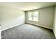 Bedroom featuring a window with natural light and plush carpet floors at 122 Southern Estates Dr, Sanford, NC 27330