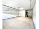 Spacious and clean two-car garage with a water heater, electrical panel and side door at 122 Southern Estates Dr, Sanford, NC 27330