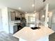 Modern kitchen featuring quartz countertops, stainless steel appliances, and ample storage at 122 Southern Estates Dr, Sanford, NC 27330