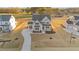 Aerial view of two-story home with attached garage and landscaping at 130 Summerlin Dr, Clayton, NC 27527
