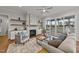 Spacious living room with fireplace, built-in shelving, and access to a screened porch at 130 Summerlin Dr, Clayton, NC 27527