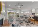 Spacious living room with fireplace, built-in shelving, and access to a screened porch at 130 Summerlin Dr, Clayton, NC 27527