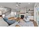Spacious living room with fireplace, built-in shelving, and access to a screened porch at 130 Summerlin Dr, Clayton, NC 27527