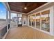 Relaxing screened porch with wooden deck and access to backyard at 130 Summerlin Dr, Clayton, NC 27527