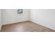 Bedroom with wood laminate floors and bright white walls at 270 Chestnut Oak Ln, Lillington, NC 27546
