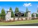 Community entrance sign 'Matthews Ridge' with stone pillars and landscaping at 270 Chestnut Oak Ln, Lillington, NC 27546