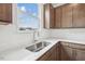 Bright kitchen with stainless steel sink, white countertops, and shaker cabinets at 270 Chestnut Oak Ln, Lillington, NC 27546