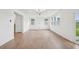 Open living room with lots of natural light and wood laminate floors at 270 Chestnut Oak Ln, Lillington, NC 27546