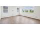 Open living room with lots of natural light and wood laminate floors at 270 Chestnut Oak Ln, Lillington, NC 27546