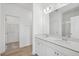 Bathroom with double vanity and access to closet at 234 Chestnut Oak Ln, Lillington, NC 27546