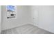 Simple bedroom with carpet, double closet, and window at 234 Chestnut Oak Ln, Lillington, NC 27546