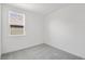 Spacious bedroom with gray carpet and a window at 234 Chestnut Oak Ln, Lillington, NC 27546