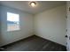 Simple bedroom with a window and neutral wall colors at 234 Chestnut Oak Ln, Lillington, NC 27546