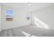 Bright bedroom with two windows and gray carpet at 234 Chestnut Oak Ln, Lillington, NC 27546
