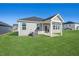 Back of house featuring covered patio and grassy yard at 234 Chestnut Oak Ln, Lillington, NC 27546