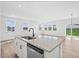 Open concept kitchen with island and stainless steel appliances at 234 Chestnut Oak Ln, Lillington, NC 27546
