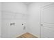 Laundry room with shelving and hookups at 234 Chestnut Oak Ln, Lillington, NC 27546