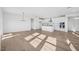 Open living room with hardwood floors and kitchen view at 234 Chestnut Oak Ln, Lillington, NC 27546