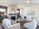 Living room with fireplace, built-in shelving, and hardwood floors at 1004 Azalea Garden Circle, Raleigh, NC 27603