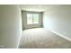 Comfortable bedroom featuring neutral walls, carpet and a bright window at 316 Bishop Ln, Sanford, NC 27330