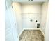 Functional laundry room with practical tile flooring and wire shelving at 316 Bishop Ln, Sanford, NC 27330