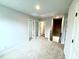 Spacious living room with carpeted floors and multiple doorways at 316 Bishop Ln, Sanford, NC 27330