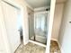 Modern glass shower featuring gray tiling and a shower head at 316 Bishop Ln, Sanford, NC 27330