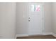 Bright entryway with white door and wood flooring at 212 Gregory Village Dr, Lillington, NC 27546