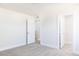 Simple bedroom with carpet flooring and two closets at 395 Fast Pitch Ln, Four Oaks, NC 27524