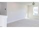 Spacious bonus room with neutral carpeting and abundant natural light at 395 Fast Pitch Ln, Four Oaks, NC 27524